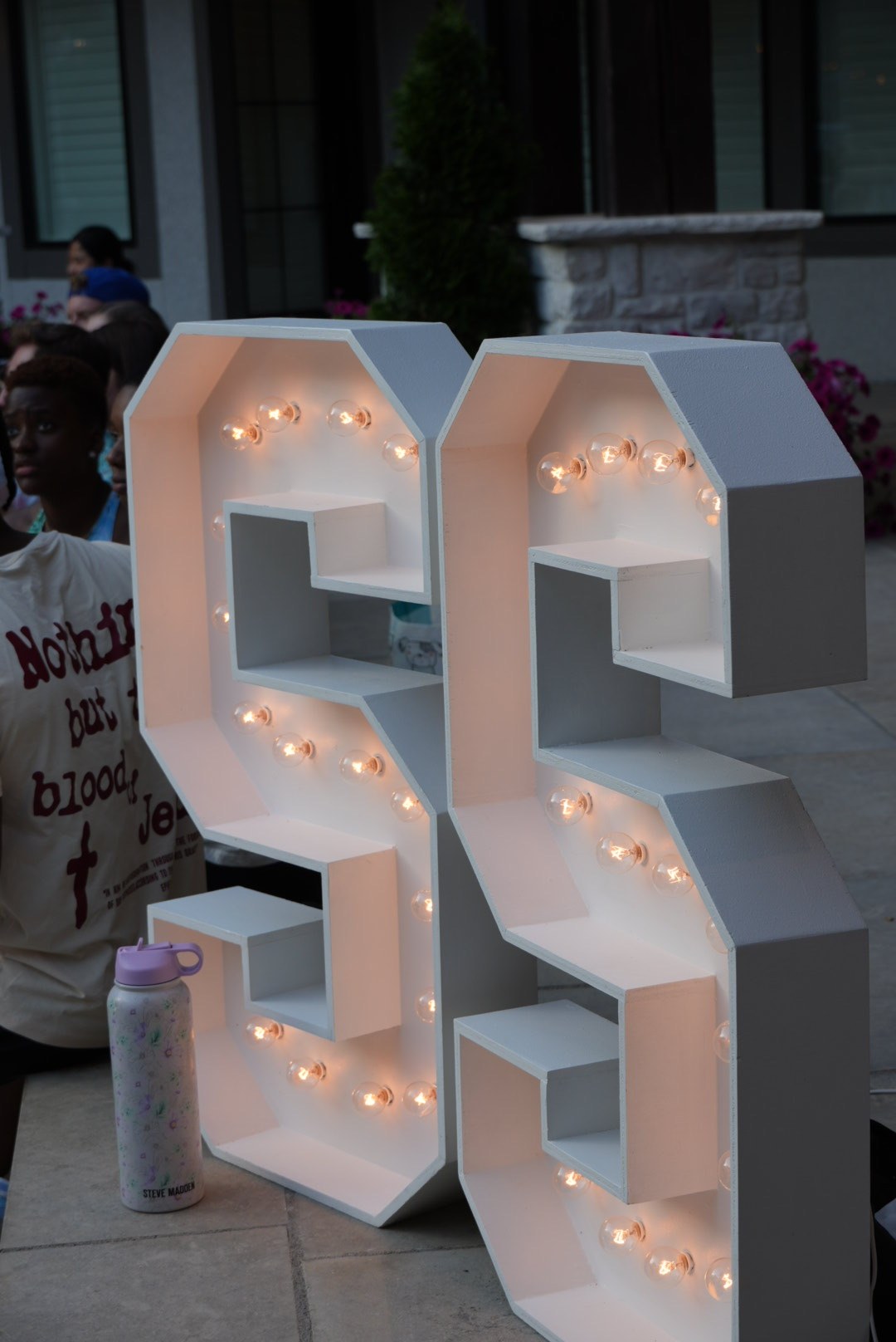 Illuminated SS letters at a Sunday S'mores gathering